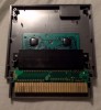 View of inside a 5 screw NES Game containing a Famicom Converter